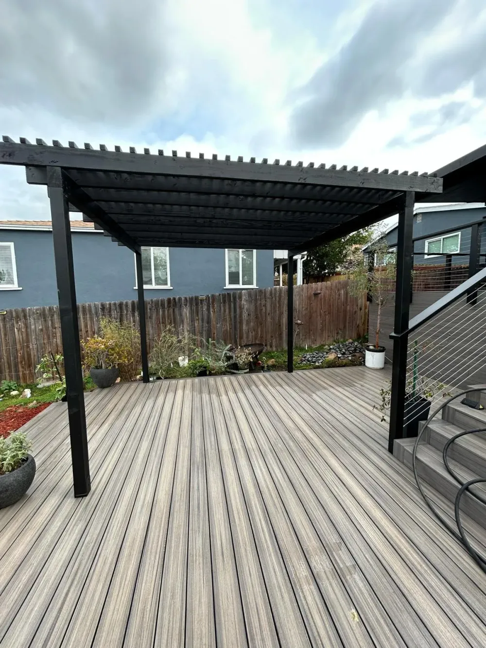 Bavarian Drive deck, patio cover and hardscape project by Guild Builders