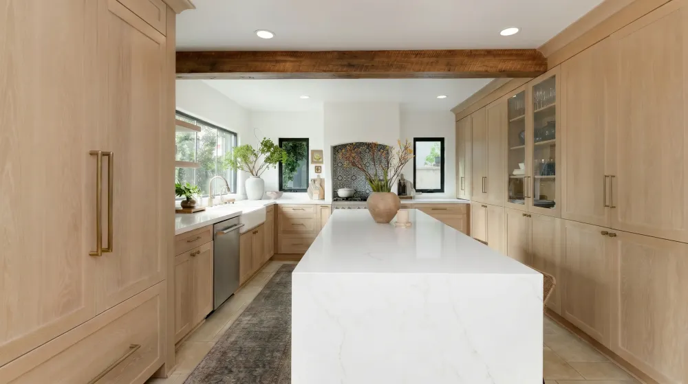 Remodeled kitchen with custom cabinetry by Guild Builders